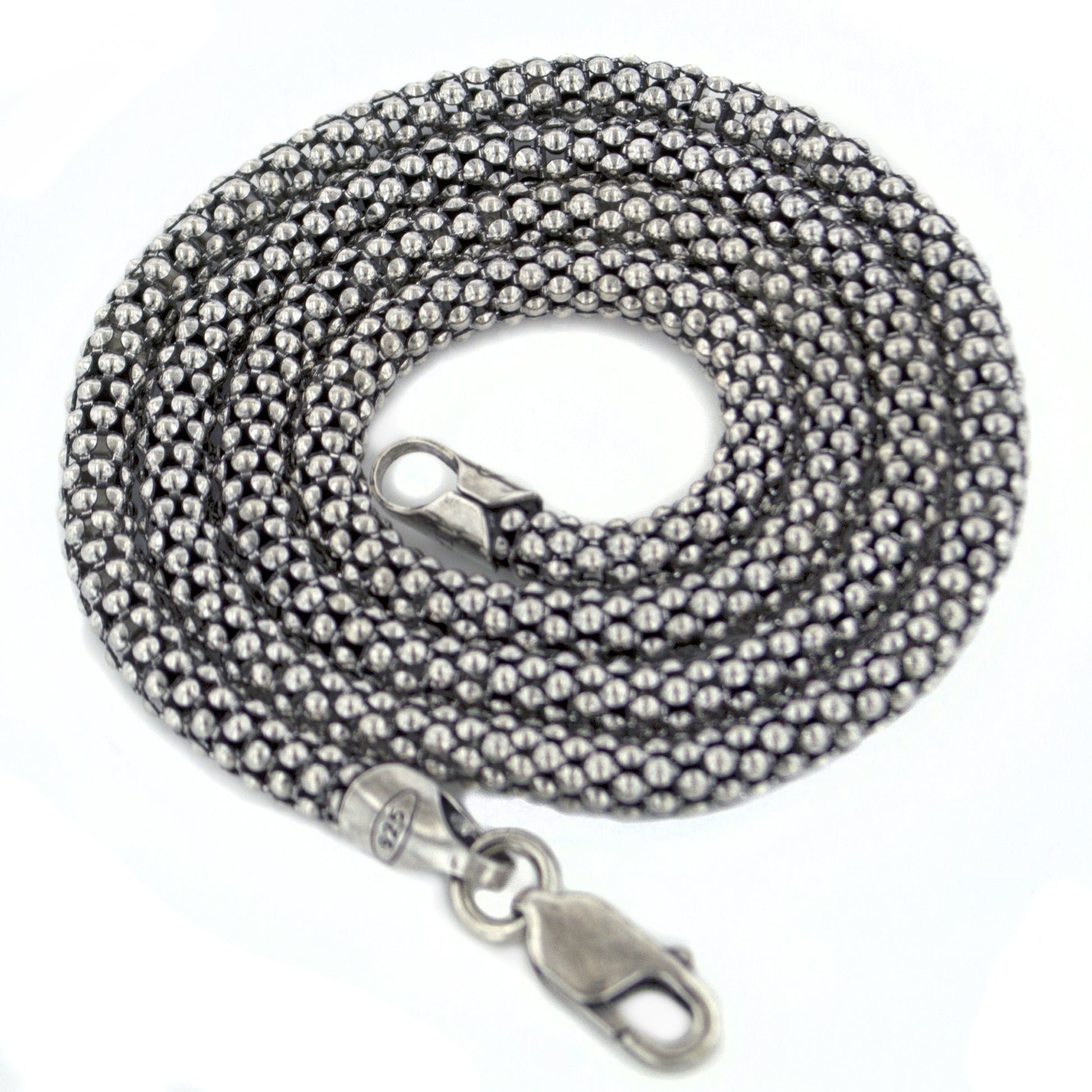 A coiled antiqued sterling silver popcorn chain with a lobster clasp.